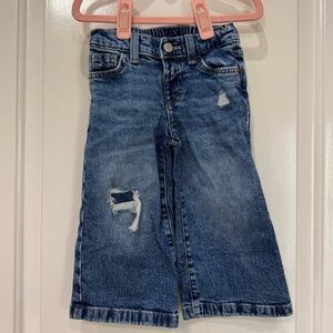 Distressed denim jeans